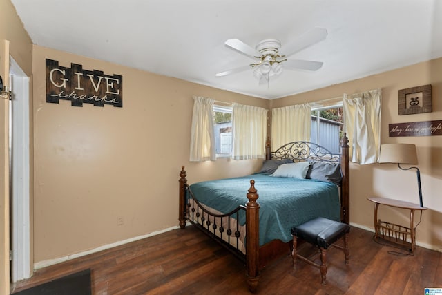 bedroom featuring ceiling fan and dark wood-type flooring