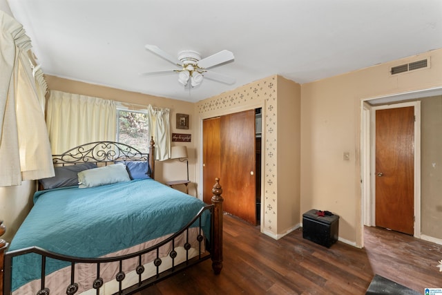 bedroom featuring ceiling fan and dark hardwood / wood-style flooring