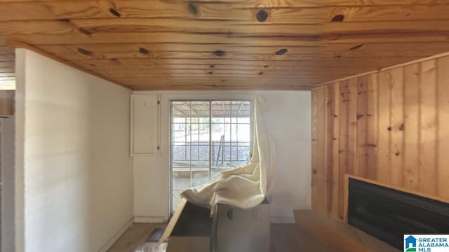 interior space with wooden walls and wooden ceiling