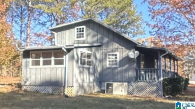 view of property exterior featuring covered porch and central AC unit