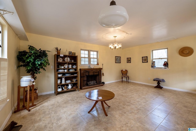 living room featuring a wealth of natural light and a chandelier