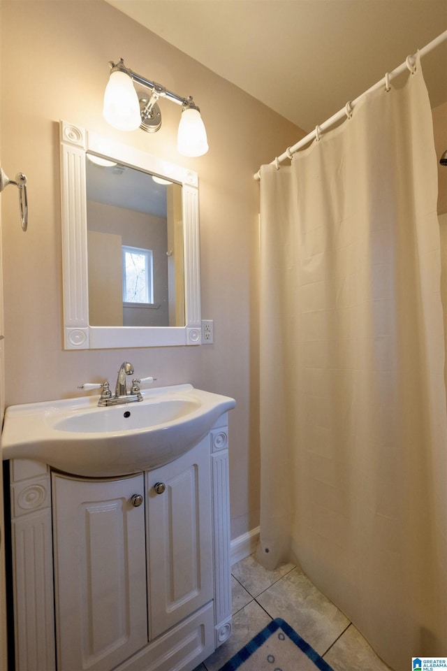 bathroom with tile patterned flooring and vanity