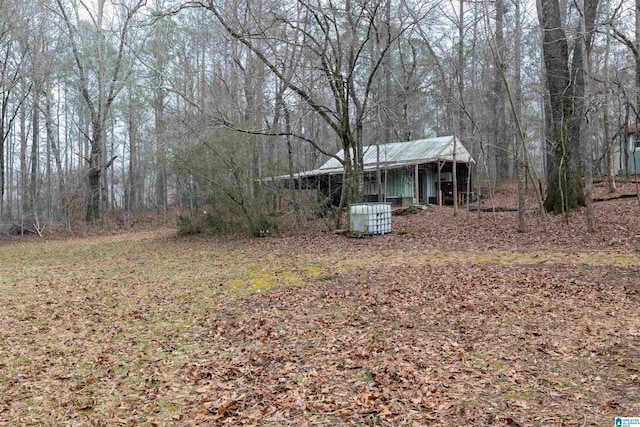 view of yard featuring central air condition unit