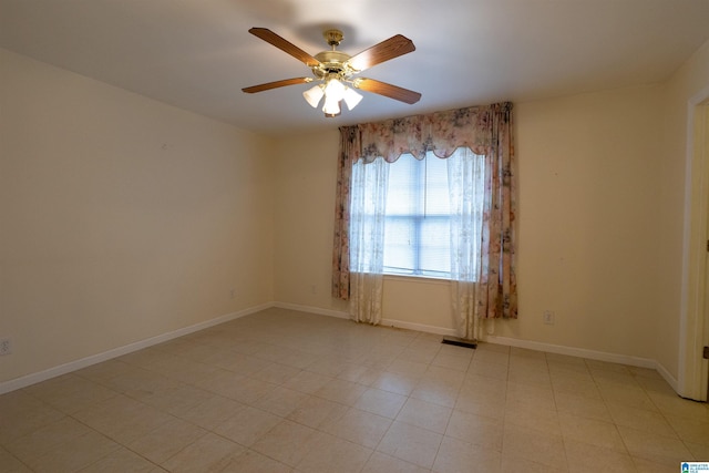 spare room with ceiling fan