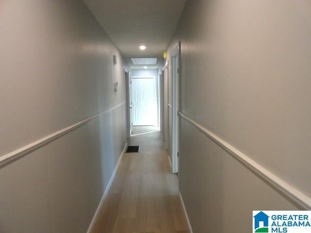 corridor featuring light hardwood / wood-style flooring