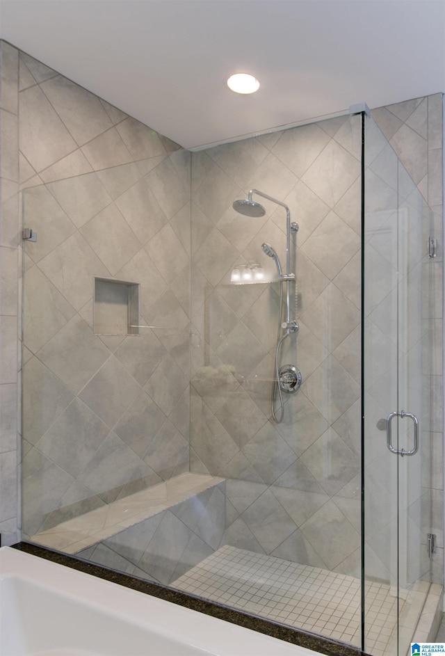 bathroom with a shower with shower door