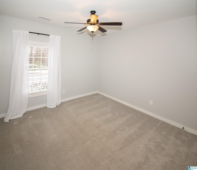 empty room with carpet and ceiling fan