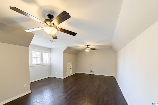 bonus room featuring ceiling fan, dark wood-type flooring, and vaulted ceiling