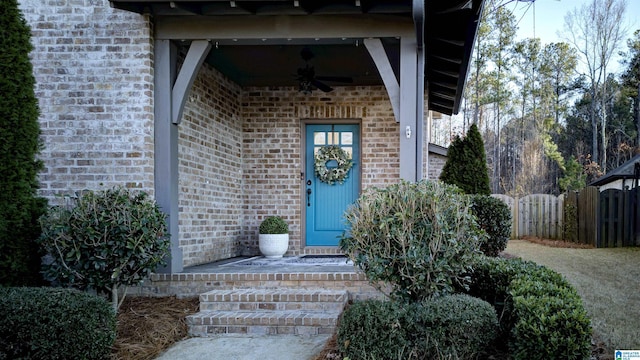 doorway to property featuring ceiling fan