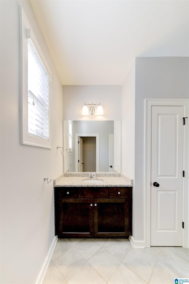 bathroom with vanity and tile patterned floors