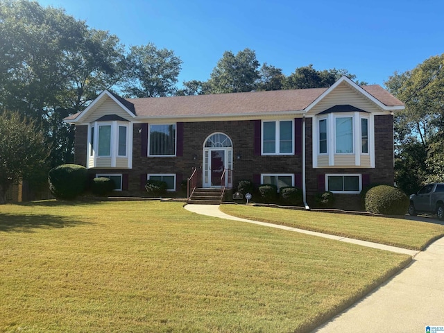 bi-level home with a front yard