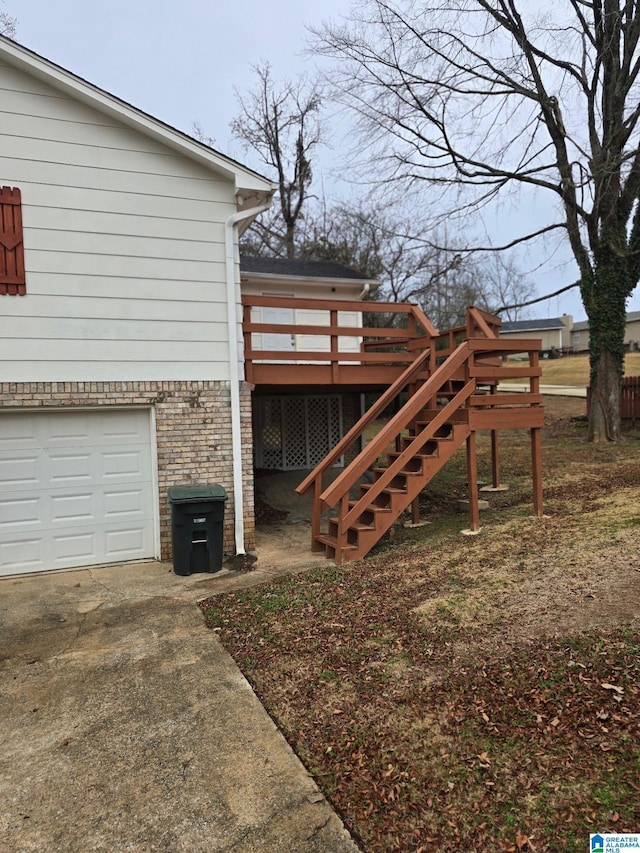 view of yard with a wooden deck and a garage