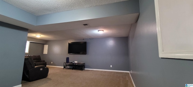 living room with a textured ceiling and carpet floors