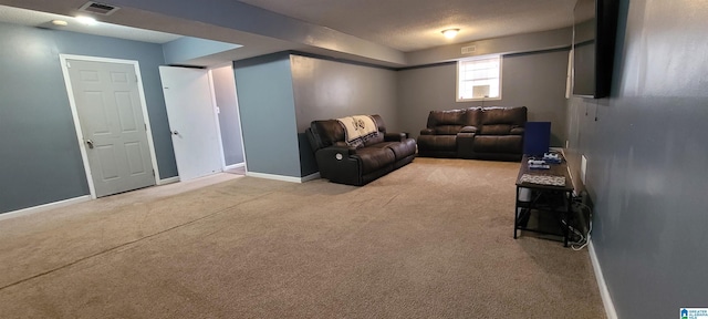 carpeted living room with a textured ceiling