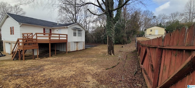 view of yard featuring a wooden deck