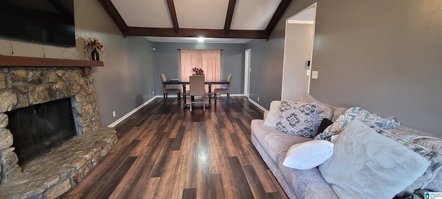 living room featuring a fireplace, dark hardwood / wood-style floors, and lofted ceiling with beams