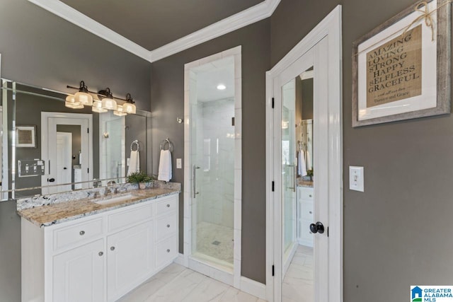 bathroom with vanity, a shower with door, and crown molding