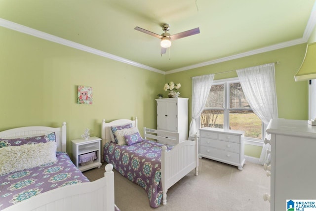 carpeted bedroom with ceiling fan and crown molding