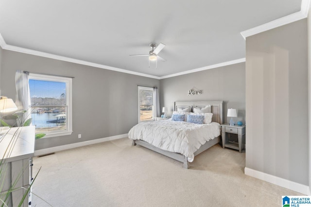 bedroom with ceiling fan, light colored carpet, crown molding, and multiple windows