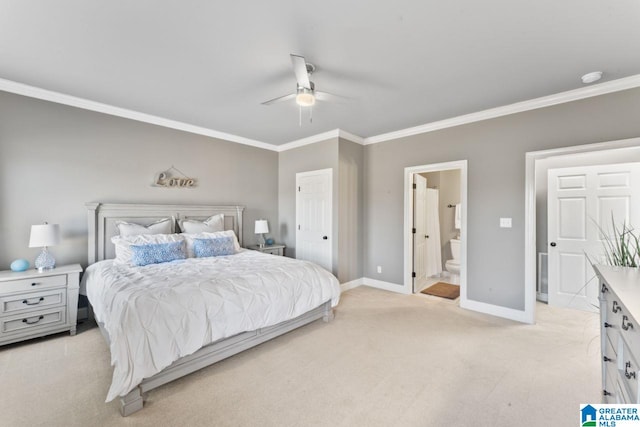 carpeted bedroom featuring ceiling fan, crown molding, and ensuite bathroom