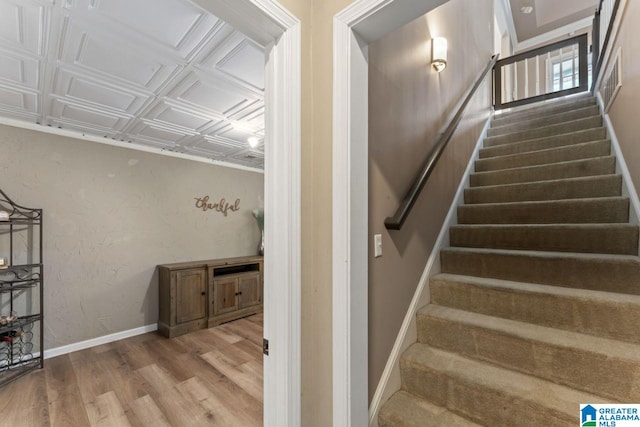 stairs with hardwood / wood-style flooring