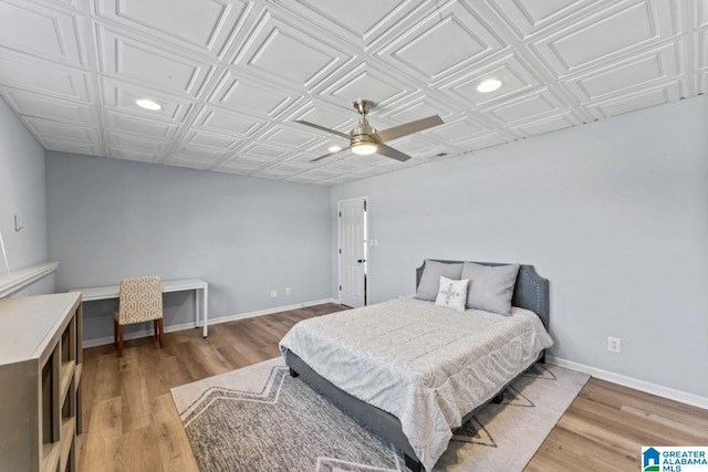 bedroom featuring ceiling fan and wood-type flooring