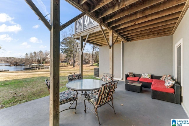 view of patio featuring a water view and an outdoor hangout area