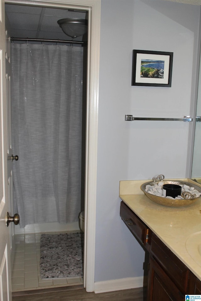 full bathroom featuring hardwood / wood-style floors, vanity, toilet, and shower / bath combo with shower curtain