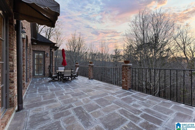 view of patio terrace at dusk