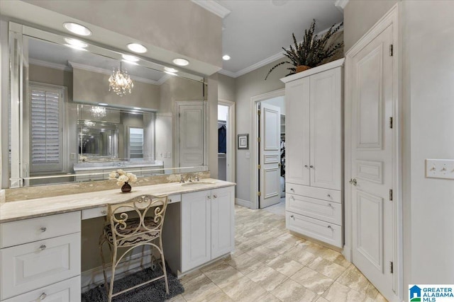 bathroom featuring vanity, crown molding, and a chandelier