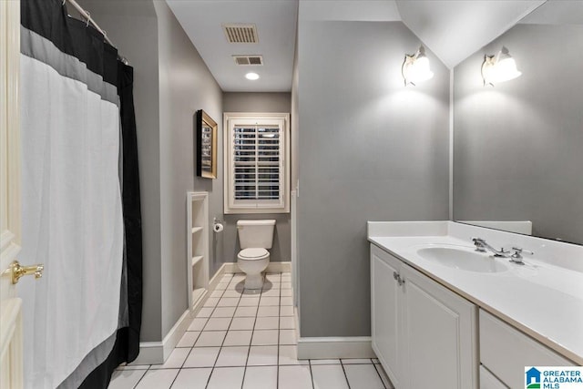 bathroom with vanity, lofted ceiling, tile patterned floors, toilet, and walk in shower