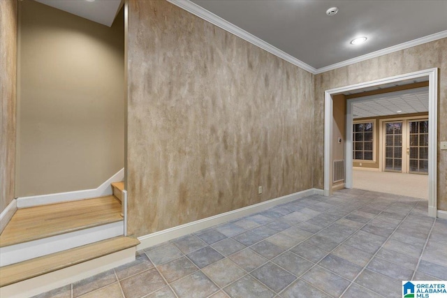 spare room featuring crown molding