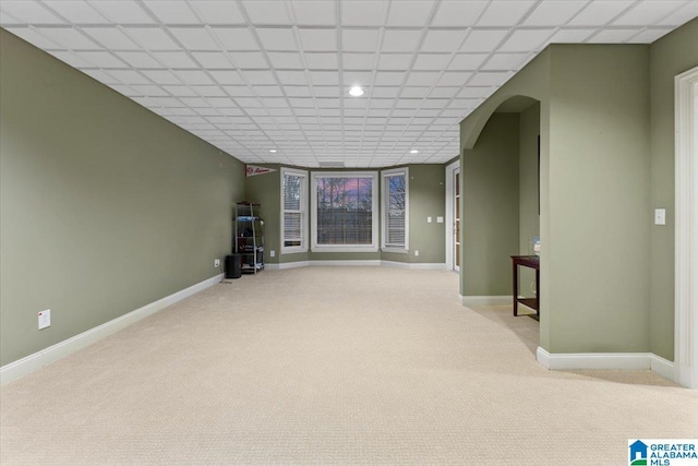 basement featuring light colored carpet