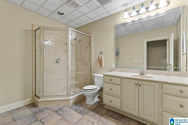 bathroom with vanity, an enclosed shower, and toilet