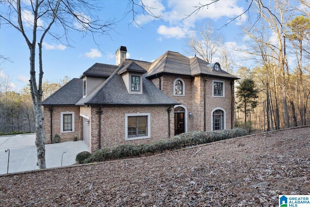 french country home with a patio