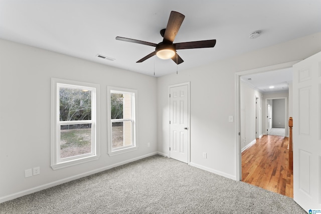 unfurnished bedroom featuring carpet flooring and ceiling fan