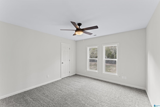 spare room with ceiling fan and carpet flooring