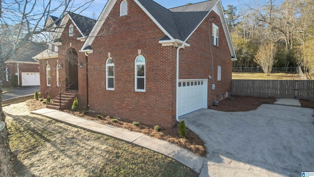 view of side of home with a garage