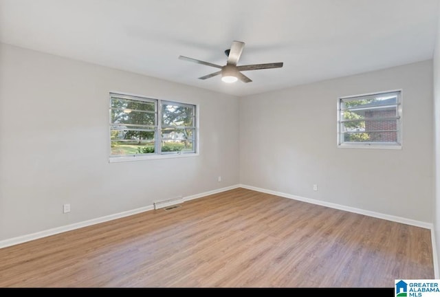 spare room with ceiling fan and light hardwood / wood-style floors