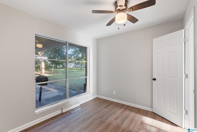 spare room featuring ceiling fan and wood-type flooring