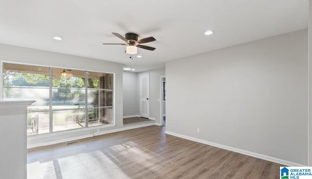 spare room featuring ceiling fan and hardwood / wood-style flooring