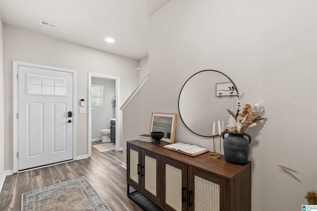 foyer entrance featuring wood-type flooring