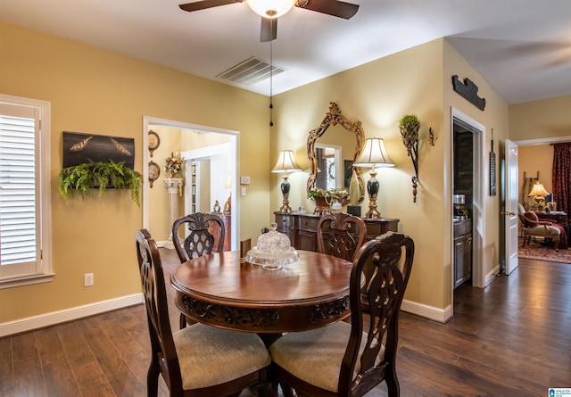 dining space featuring dark hardwood / wood-style floors and ceiling fan