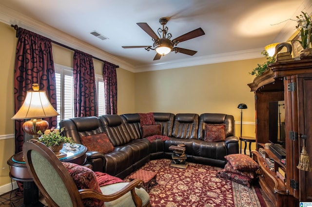 living room with ceiling fan and ornamental molding