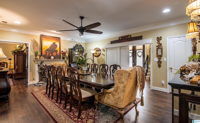 dining area with french doors, ceiling fan with notable chandelier, dark hardwood / wood-style floors, and ornamental molding