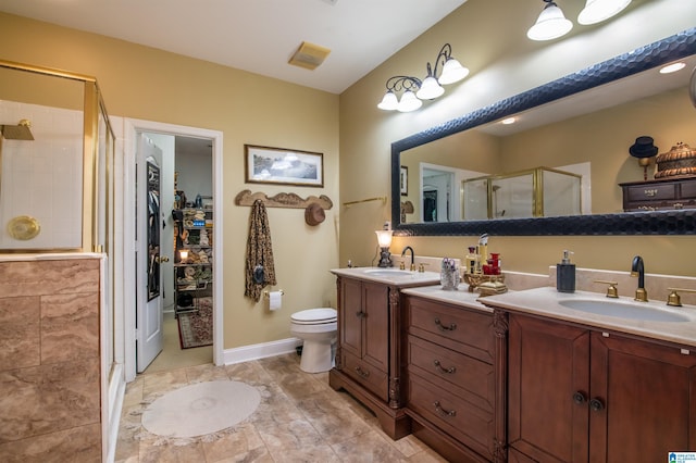 bathroom with vanity, toilet, and walk in shower