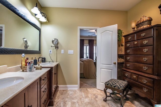 bathroom featuring vanity and ceiling fan