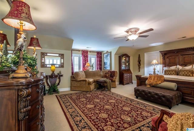 bedroom with ceiling fan and light carpet