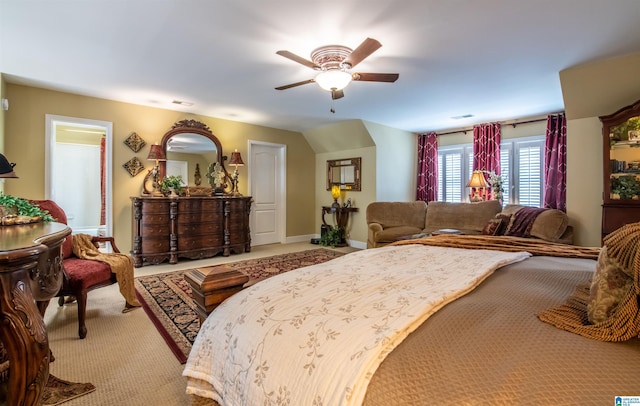 bedroom featuring ceiling fan and light carpet