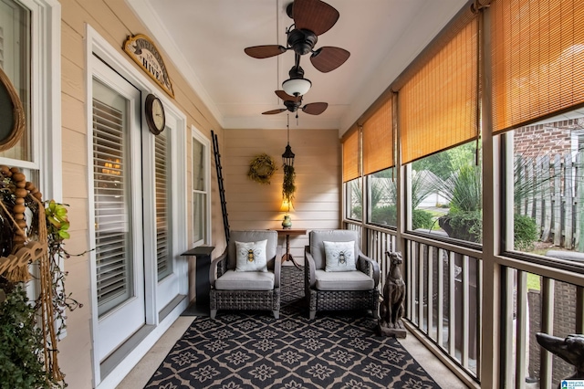 sunroom / solarium with ceiling fan